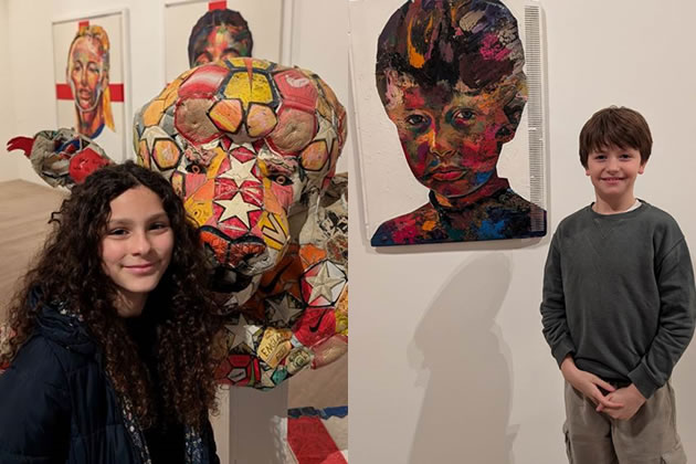 Eleven-year-old Anjelica (left) with a sculpture she helped create and eight-year-old Caspar (right) next to his portrait 